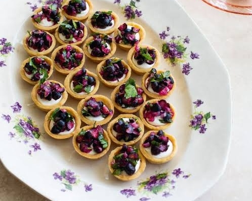 Easy Honey Glazed Goat Cheese Tarts With Edible Pansies top view